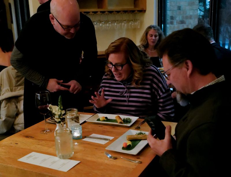 Matt McCormick, server at Red Haven Farm to Table restaurant in Okemos, explains the second course of the "Clue" themed dinner to Jeri Lynne Jensen and her husband Jim Jensen Wednesday, Jan. 28, 2026. The couple, from Eagle, said the dinner was a Christmas gift from their daughter and it was the first time eating at the restaurant.