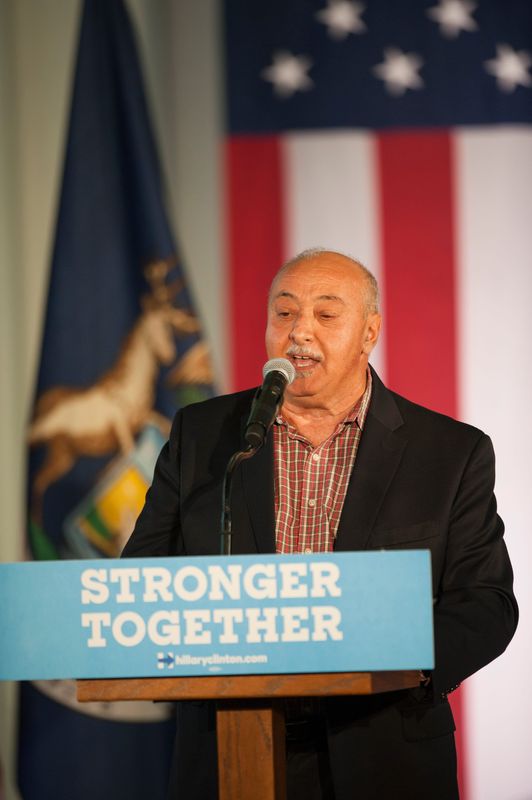 Ismael Ahmed, former director of the Michigan Department of Human Services, addresses the crowd before former President Bill Clinton goes on stage to campaign for his wife Hillary Clinton at the University of Michigan Flint Campus, on Monday October 3, 2016.