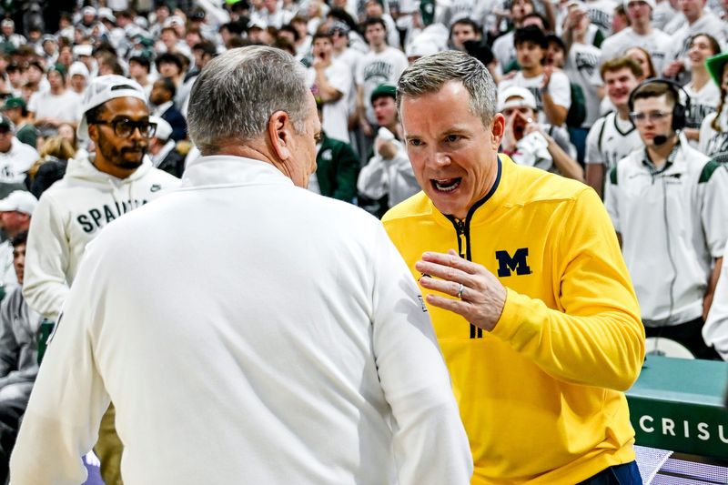 Michigan State's head coach Tom Izzo, left, and Michigan's head coach Dusty May meet before the game on Friday, Jan. 30, 2026, at the Breslin Center in East Lansing.