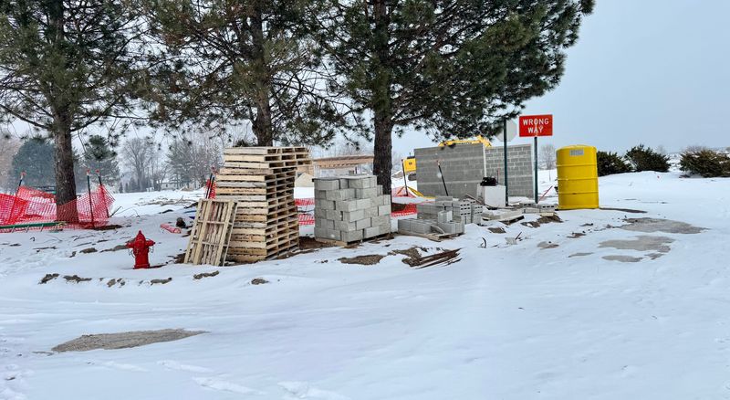 Stacks of building materials and construction fencing sit near ongoing renovation work at Tierney Park on Feb. 2, 2026, in Lexington.