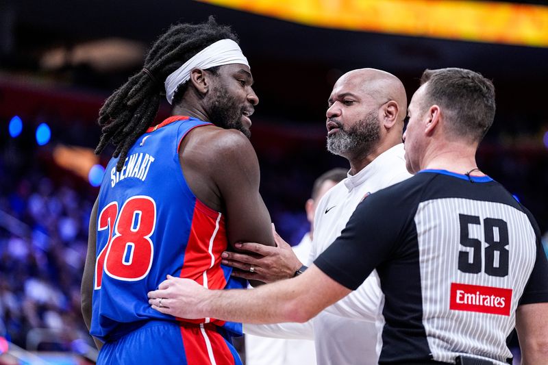 Detroit Pistons forward Isaiah Stewart (28) and head coach J.B. Bickerstaff talk to a referee regarding a call during the first half against Denver Nuggets at Little Caesars Arena in Detroit on Tuesday, February 3, 2026.