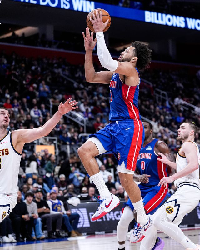 Detroit Pistons guard Cade Cunningham (2) makes a layup against Denver Nuggets during the second half at Little Caesars Arena in Detroit on Tuesday, February 3, 2026.