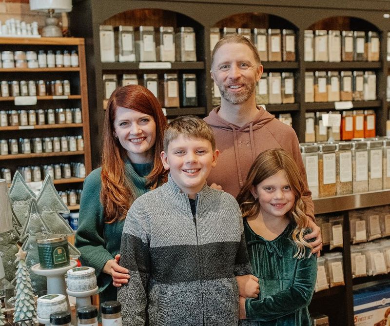 Jessica and Travis Lang (back) pose with their children Brecken and Britta Lang at The Seasoned Home in downtown Holland.