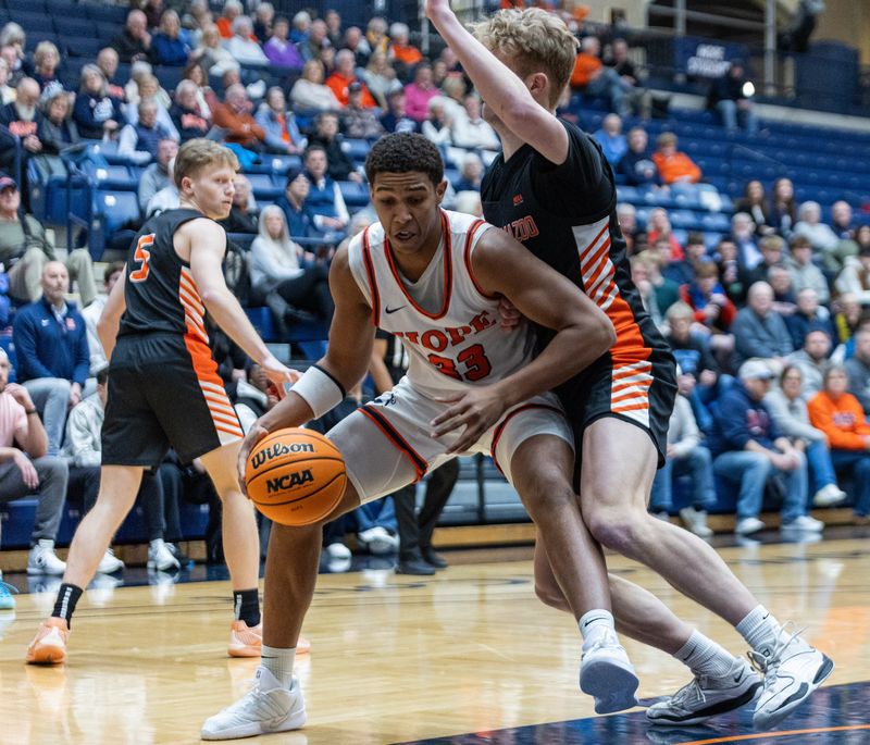 Hope’s Orion Yant backs down the Kalamazoo defender before the shot attempt on Wednesday, Feb. 4.