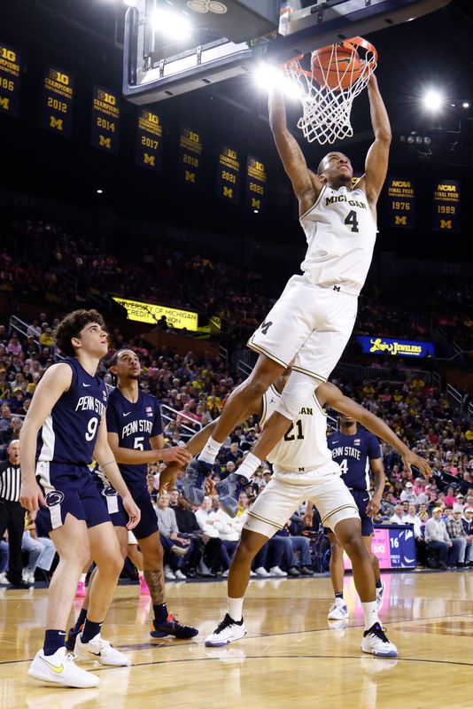 Michigan Wolverines guard Nimari Burnett (4) dunks in the first half against the Penn State Nittany Lions at Crisler Center in Ann Arbor on Thursday, Feb. 5, 2026.