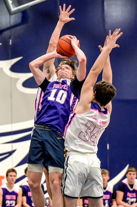 Pewamo-Westphalia's Grady Eklund, left, shoots as Fowler's Joe Epkey defends during the fourth quarter on Thursday, Feb. 5, 2026, at Fowler High School.