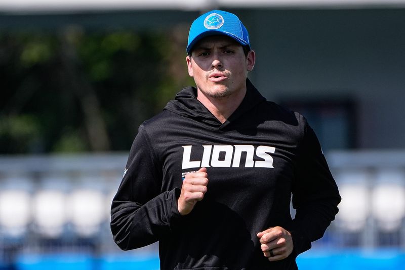 Detroit Lions assistant offensive line coach Steve Oliver
walks off the field after practice during training camp at Meijer Performance Center in Allen Park on Thursday, July 24, 2025.