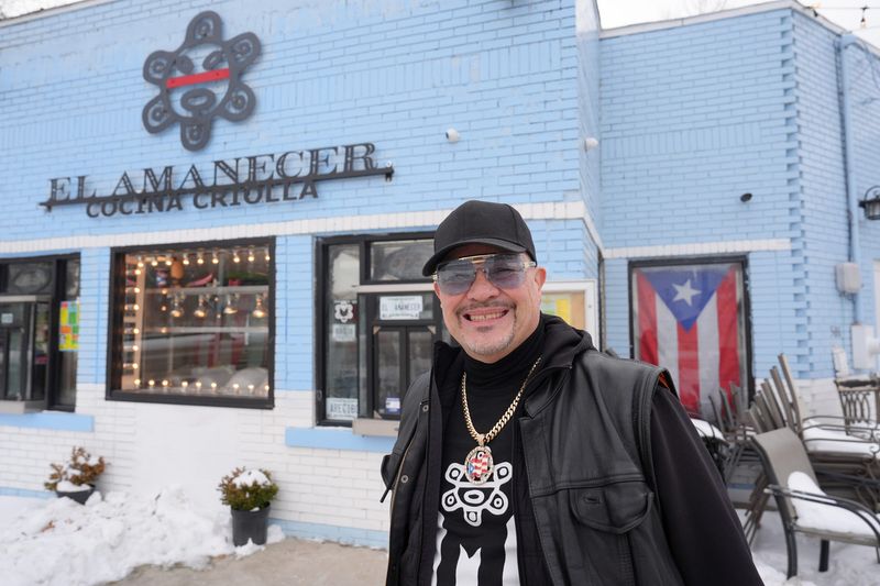 Alberto Ruiz stands outside of El Amanecer in Ecorse on Thursday, Feb. 5, 2026. Ruiz is the manager at the Puerto Rican cuisine restaurant. Ruiz says he customers feel like they are family. Ruiz says he sees El Amanecer as way to highlight Puerto Rican culture in metro Detroit and to express that heritage through food.