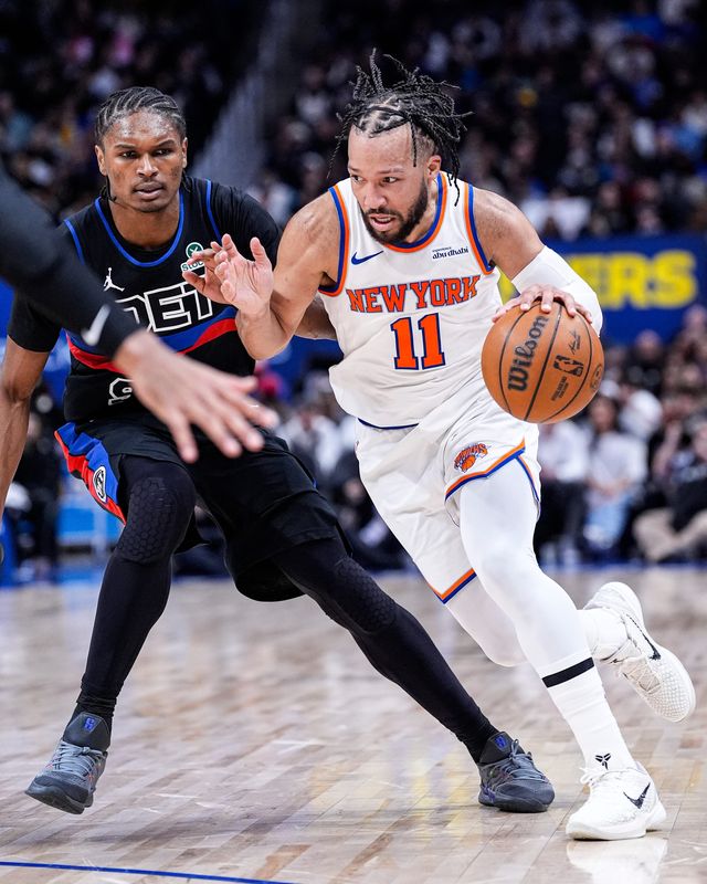 New York Knicks guard Jalen Brunson (11) dribbles against Detroit Pistons guard Ausar Thompson (9) during the second half at Little Caesars Arena in Detroit on Friday, February 6, 2026.