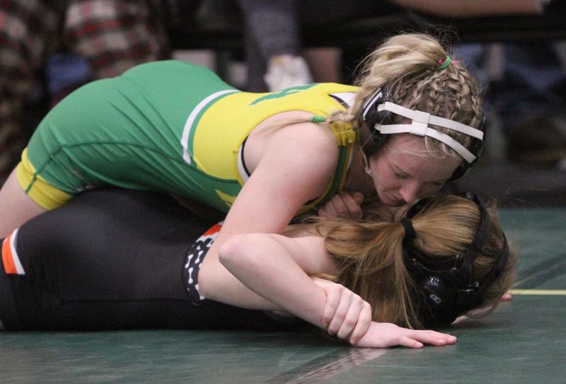 Howell's Ava Adkins (top) beat Brighton's Reese Cournoyer during the KLAA girls wrestling tournament on Saturday, Feb. 7, 2026 at Howell High School.
