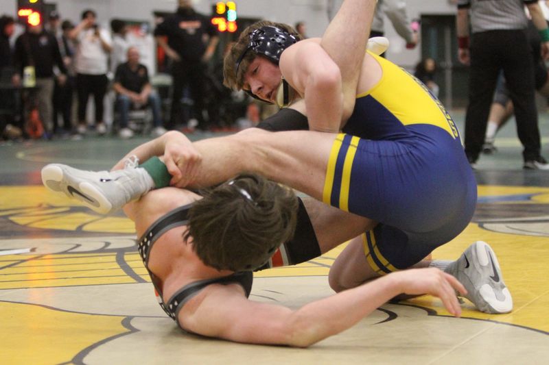 Hartland's Dallas Korponic (right) beat Brighton's Xander Courneya in the 157-pound final to win his fourth KLAA wrestling championship on Saturday, Feb. 7, 2026 at Howell High School.