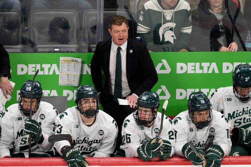Michigan State head coach Adam Nightingale during the first period of the annual Duel in the D hockey game between the University of Michigan and Michigan State.