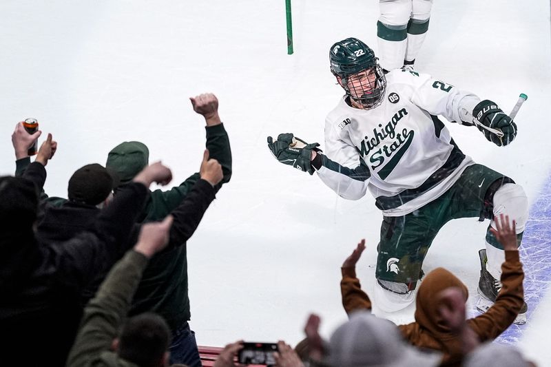 Michigan State forward Porter Martone (22) celebrates scoring a goal against Michigan during the first period of Duel in the D at Little Caesars Arena in Detroit on Saturday, February 7, 2026.