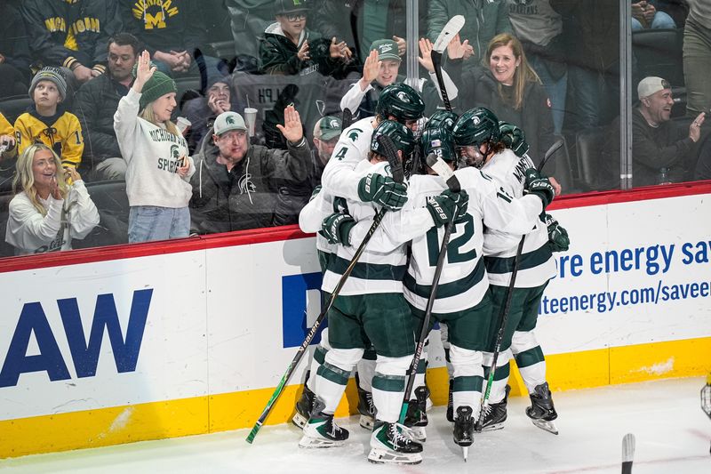 Michigan State players celebrate a goal against Michigan during the second period of Duel in the D at Little Caesars Arena in Detroit on Saturday, February 7, 2026.