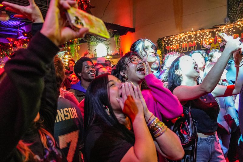 The crowd reacts to the performance by Puerto Rican artist Bad Bunny during the Bad Bunny Super Bowl watch party at Tulum Detroit inside Taqueria El Rey in the heart of Mexican Town in Detroit, Sunday, Feb. 8, 2026.