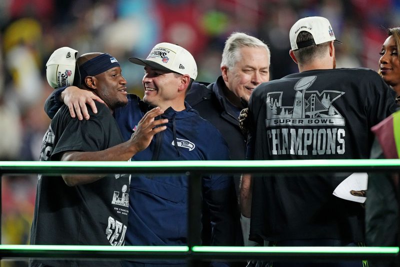 Seattle Seahawks head coach Mike MacDonald and Seattle Seahawks running back Kenneth Walker III (9) celebrate the win against the New England Patriots in Super Bowl LX at Levi's Stadium in Santa Clara, California, on Sunday, Feb. 8, 2026.