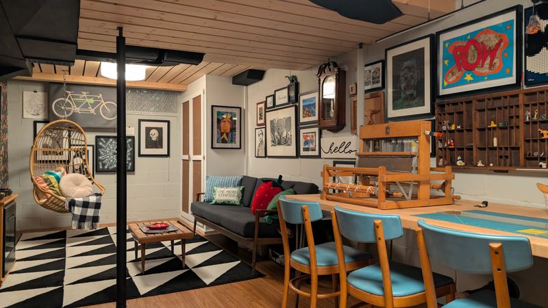 Homeowner Christina Clark takes on many DIY projects like the ceiling and floor in her remodeled basement where she also arranged and installed all the artwork.