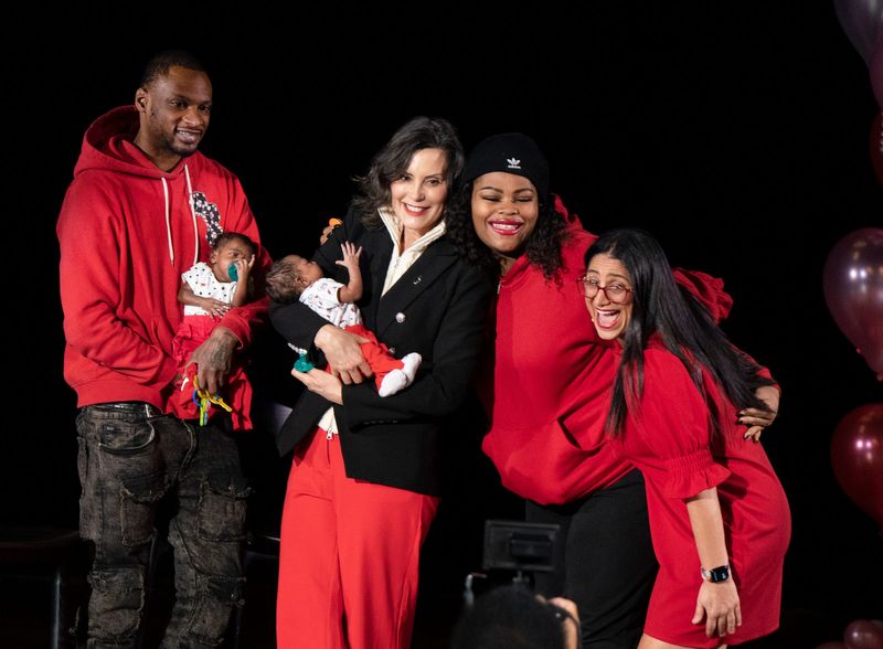 Rx Kids participants pose with their babies and Governor Gretchen Whitmer and Dr. Mona Hanna during the official launch of Rx Kids at an event at the Bonstelle Playhouse in Detroit on Monday, Feb. 9, 2026.