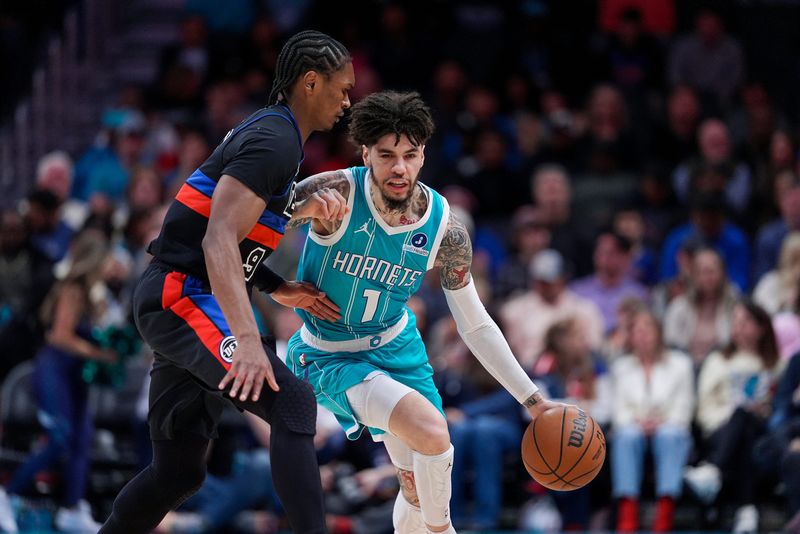 Charlotte Hornets guard LaMelo Ball drives to the basket against the defense from Detroit Pistons forward Ausar Thompson during the first quarter at Spectrum Center in Charlotte, North Carolina, on Monday, Feb. 9, 2026.