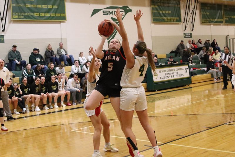 Milan's Aryana Bowden shoots over Alexa Turner of St. Mary Catholic Central during a 57-23 SMCC victory on Monday, Feb. 9, 2026.
