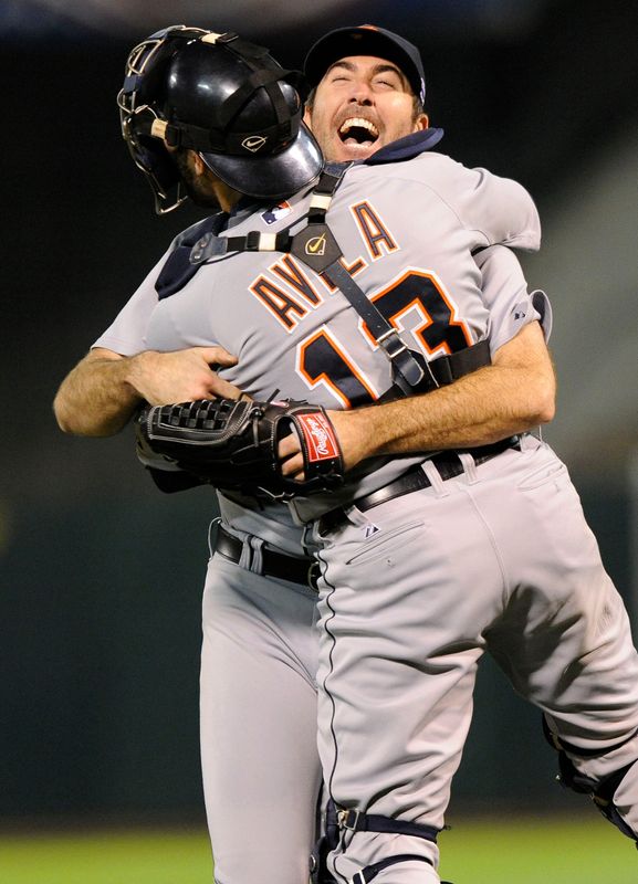 Tigers catcher Alex Avila (13) hugs pitcher Justin Verlander after the Tigers beat the Athletics, 6-0 in Game 5 of the 2012 American League Division Series. Verlander fired a complete-game shutout.