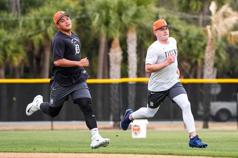 Detroit Tigers infielder Hao-Yu Lee, left, and infielder Kevin McGonigle practice during spring training at TigerTown in Lakeland, Fla. on Wednesday, Feb. 11, 2026.