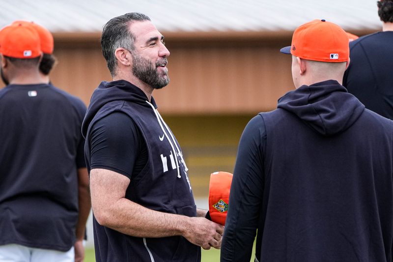 Detroit Tigers pitcher Justin Verlander, left, talks to pitcher Tarik Skubal at practice during spring training at TigerTown in Lakeland, Fla. on Wednesday, Feb. 11, 2026.