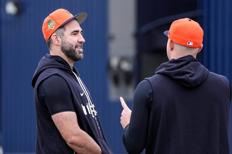 Detroit Tigers pitcher Justin Verlander, left, talks to pitcher Tarik Skubal at practice during spring training at TigerTown in Lakeland, Fla. on Wednesday, Feb. 11, 2026.