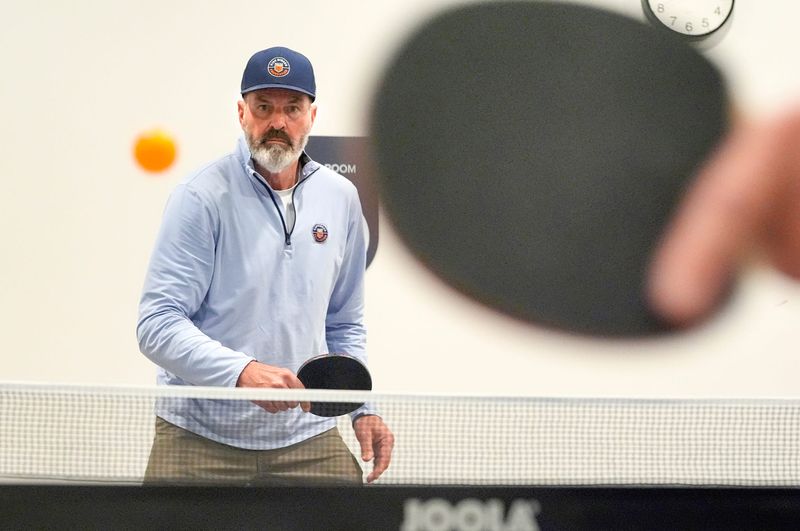 Kirk Gibson plays a competitive game of ping-pong at the Kirk Gibson Center for Parkinson’s Wellness in Farmington Hills on Friday, Dec. 19, 2025. The center, which opened in August  2025, offers people in various stages of Parkinson’s disease to get the help they need from movement-based therapies to help keep muscles active, lifestyle and speech classes, along with counseling.