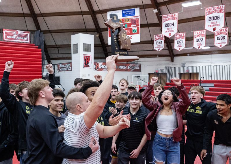 Zeeland East wins the O.K. Wrestling Team Districts on Wednesday, Feb. 11.