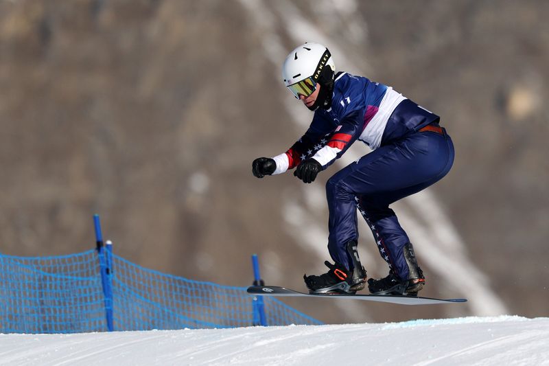 Jake Vedder of Pinckney competes in men's snowboard cross during the Milano Cortina 2026 Olympic Winter Games at Livigno Snow Park on Thursday, Feb. 12, 2026.