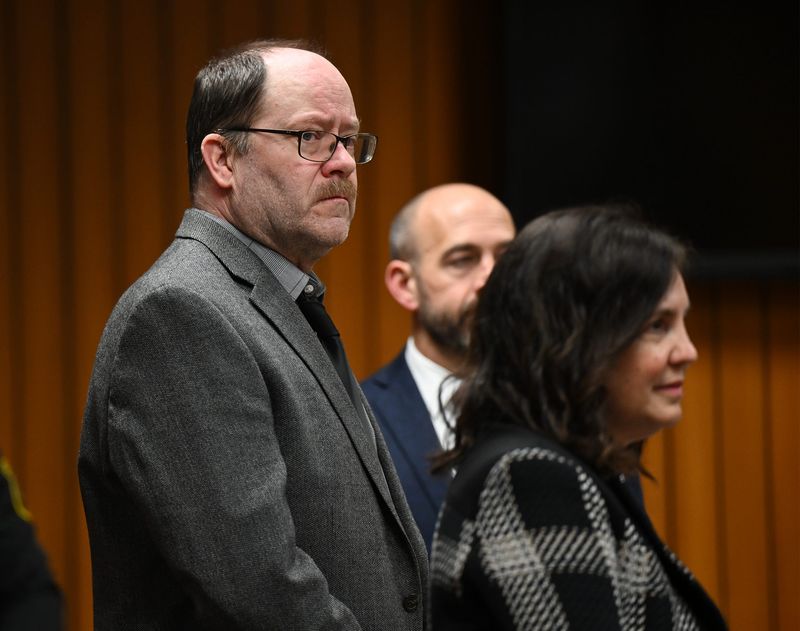 Dale Warner looks at members of the jury as they enter the courtroom for his murder trial. He is charged with killing his wife, Dee, and putting her body into a fertilizer tank at Lenawee Circuit Court on February 12, 2026, in Adrian, MI.
