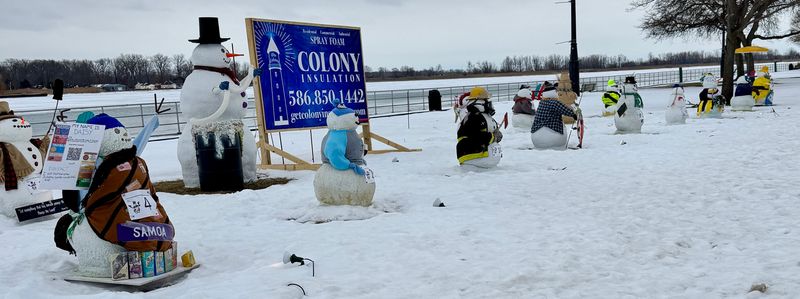 Decorated snowmen line the riverfront along St. Clair River Drive in Algonac on Feb. 11, 2026, as part of the city’s 1st annual Snowman Decoration Contest.