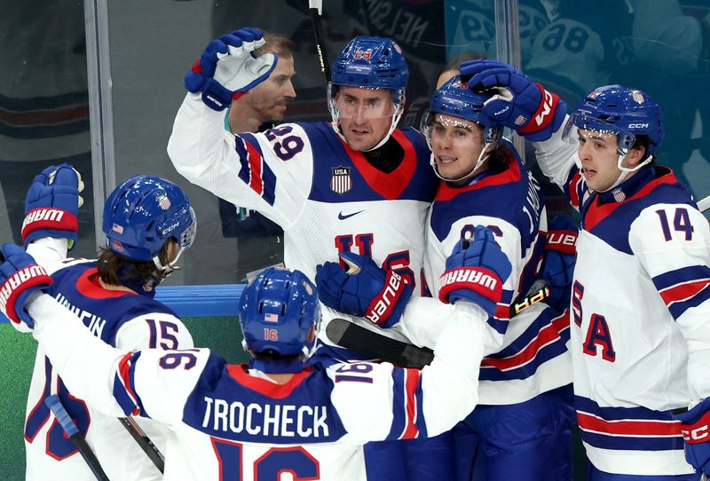 [US, Mexico & Canada customers only] Feb 12, 2026; Milan, Italy; Brock Nelson of United States celebrates scoring their second goal with teammates against Latvia in men's ice hockey group C play during the Milano Cortina 2026 Olympic Winter Games at Milano Santagiulia Ice Hockey Arena. Mandatory Credit: Mike Segar/Reuters via Imagn Images