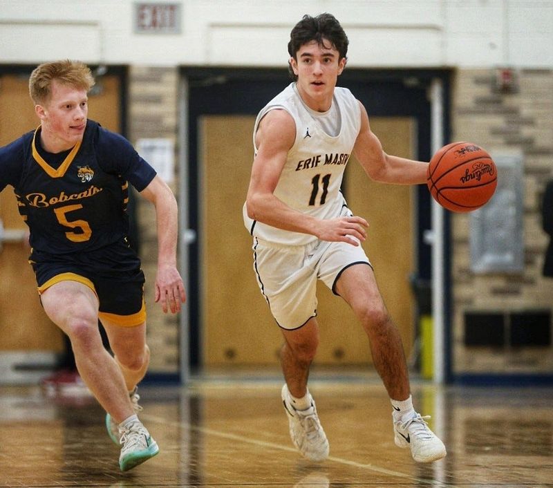 Erie Mason's Logan Doom is hounded by Drew Ruddy of Whiteford during a 63-47 Whiteford victory on Thursday, Feb. 12, 2026.