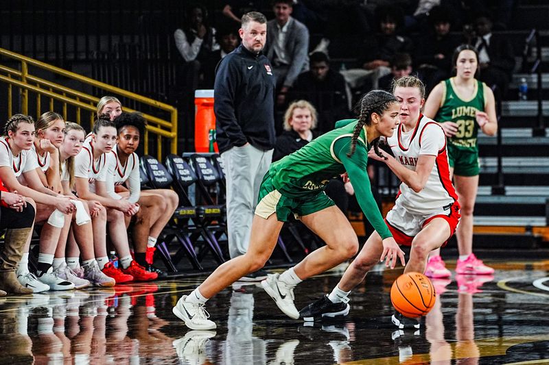 Jackson Lumen Christi’s Kenna Hunt (1) dribbles past Jessica Asmussen (11) during the first half of the CHSL Bishop Championship Finals at Oakland O’Rena in Rochester, Friday, Feb. 13, 2026.