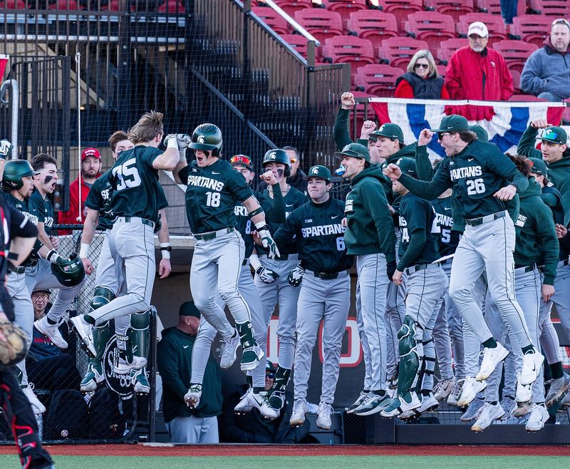 The Michigan State team celebrates the go-ahead run at Jim Patterson Stadium as the Spartans defeated the Louisville Cardinals 4â€“3 in the season opener in Louisville, Ky., on Friday, Feb. 13, 2026.