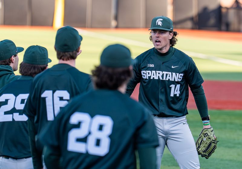 Michigan State pitcher Tommy Szczepanski (14) celebrates after the final out at Jim Patterson Stadium as the Louisville Cardinals baseball fell 4â€“3 to the Michigan State Spartans baseball in the season opener in Louisville, Ky., on Friday, Feb. 13, 2026.