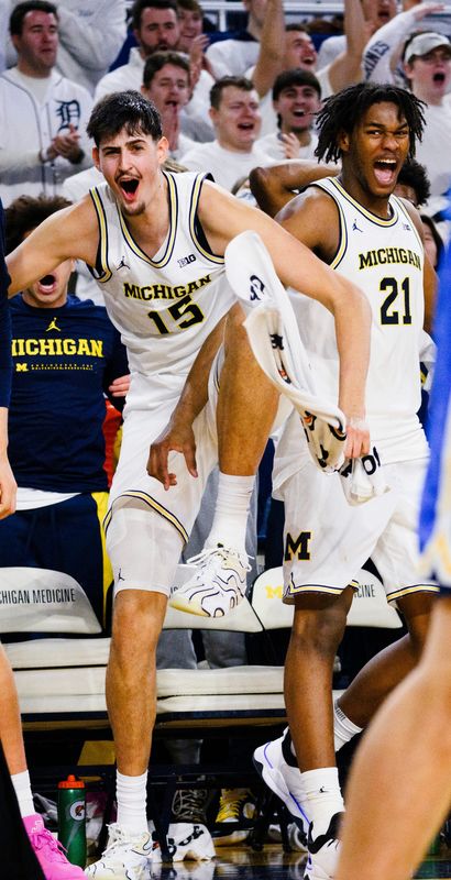 Michigan’s Aday Mara, left, and Morez Johnson Jr. have both declared for the NBA Draft with eligibility remaining.