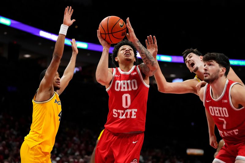 Ohio State Buckeyes guard John Mobley Jr. (0) drive past Michigan Wolverines guard Nimari Burnett (4) during the first half of the NCAA men's basketball game at the Schottenstein Center in Columbus on Feb. 8, 2026.