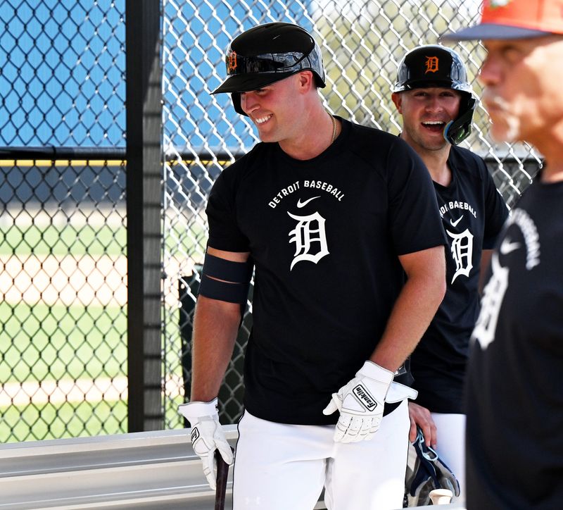 From left, Tigers’ Kerry Carpenter and Spencer Torkelson share a light moment during full squad workout at Tigers spring training in Lakeland, Fla. on Feb. 15, 2026.