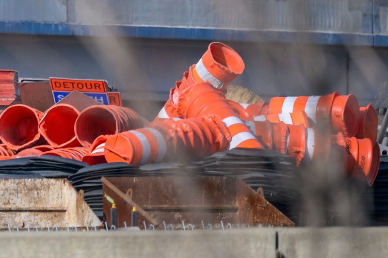 Orange barrels are piled up along with a 'detour' sign in the loading space near the west-bound on ramp from Southfield Freeway to I-94 in Allen Park awaiting coming road work. Photo taken on Sunday, Feb. 15, 2026.