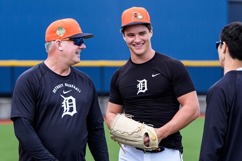Detroit Tigers manager A.J. Hinch, left, talks to pitcher Jackson Jobe during spring training at TigerTown in Lakeland, Fla. on Monday, Feb. 16, 2026.