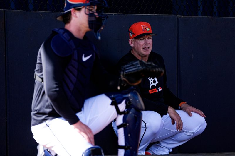 Detroit Tigers manager A.J. Hinch, right, talk to catcher Dillon Dingler at practice during spring training at TigerTown in Lakeland, Fla. on Wednesday, Feb. 18, 2026.