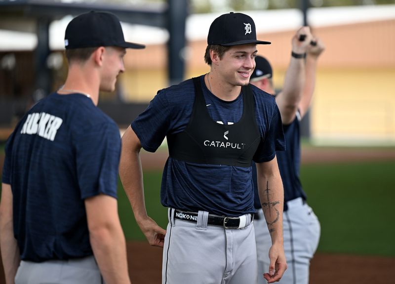 Tigers shortstop prospect Bryce Rainer, right, talks with players including Carson Rucker during the minor league workout at Tigers spring training in Lakeland, Fla. on Feb. 18, 2026.