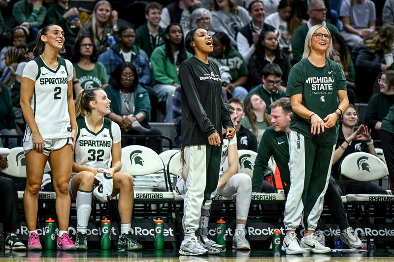 Michigan State's Rashunda Jones, center, cheers for the team during the third quarter against Northwestern on Wednesday, Feb. 18, 2026, at the Breslin Center in East Lansing.