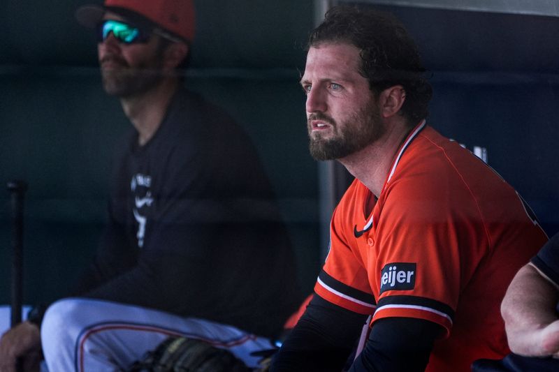Detroit Tigers pitcher Casey Mize watches practices from the dugout during spring training at TigerTown in Lakeland, Fla. on Friday, Feb. 20, 2026.