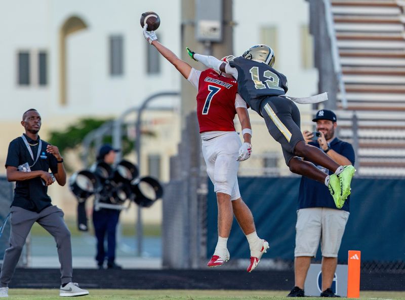 West Boca Raton Larry Morgan, right, defends a pass to Chaminade-Madonna's Jasen Lopez during the preseason kickoff classic in Boca Raton, Florida, on August 14, 2025.