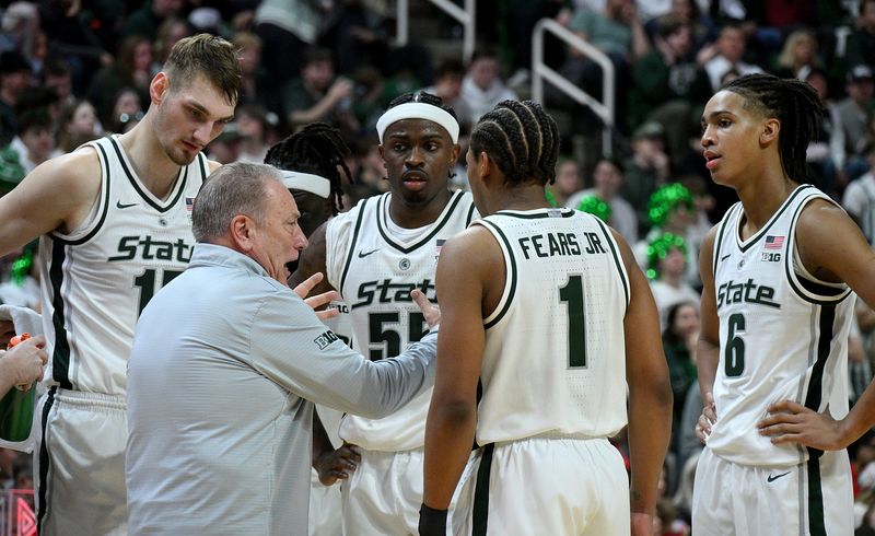 Feb 22, 2026; East Lansing, Michigan, USA; Michigan State Spartans head coach Tom Izzo huddles with his players during the first half against the Ohio State Buckeyes at Jack Breslin Student Events Center. Mandatory Credit: Dale Young-Imagn Images