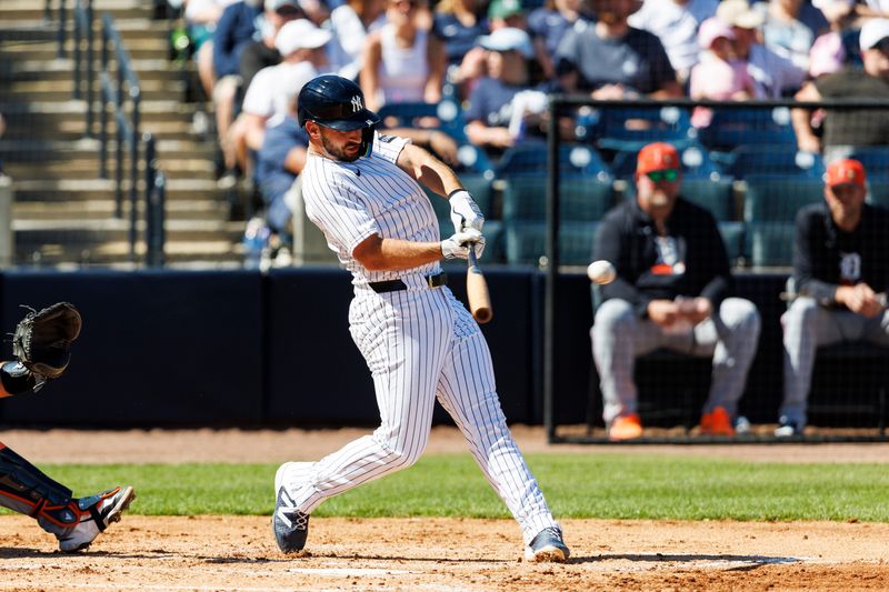 New York Yankees infielder Paul DeJong (18) hits a single against the Detroit Tigers in the during the third inning in a Spring Training game at George M. Steinbrenner Field in Tampa, Florida, on Feb. 21, 2026.